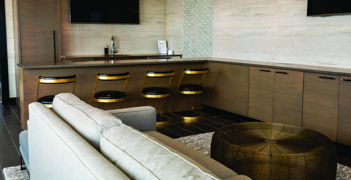 a living room with a bar and a couch